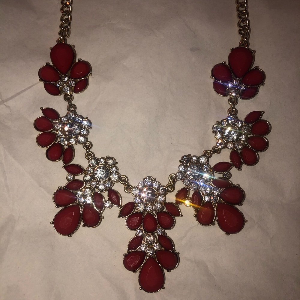 Gold diamond necklace with red accents